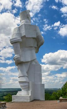 Svyatogorsk, Ukraine 07.16.2020.  Monument to Artem on the mountain above the Svyatogorsk or Sviatohirsk lavra on a sunny summer morning