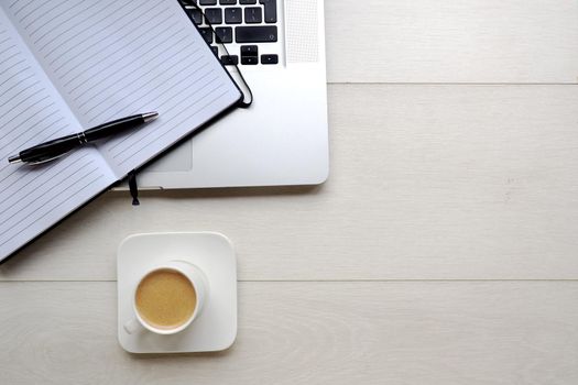 Coffee and notepad with computer