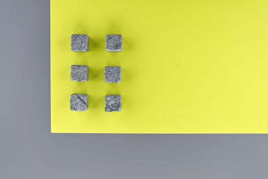Conceptual image of main color trend of the year 2021 with two tone grey and yellow background viewed as a flat lay with space for text