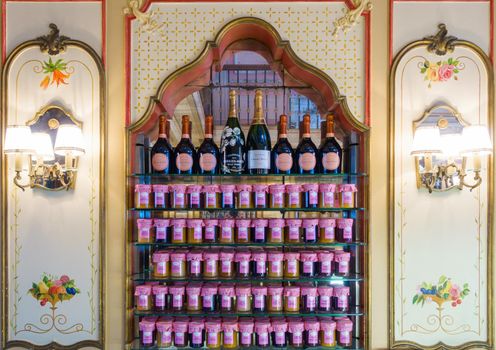 BIARRITZ, FRANCE - CIRCA SEPTEMBER 2015: Miremeont jam pots and Champagne bottles on display at Miremont tearoom.