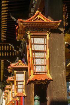 View of lantern lamps in the Kitano-Temmangu Shrine, in Kyoto, Japan