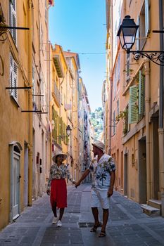 View on old part of Menton, Provence-Alpes-Cote d'Azur, France Europe during summer, couple men and woman on vacation at Menton France