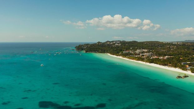 Tropical beach with tourists and clear blue sea, top view. Summer and travel vacation concept. Boracay, Philippines