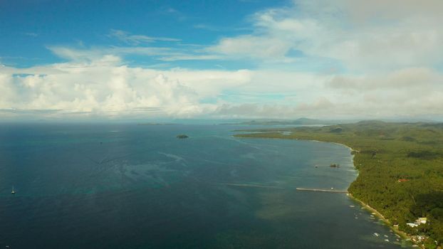 Tropical islands in turquoise lagoon and coral reef water, aerial view. Summer and travel vacation concept. Siargao,Philippines.