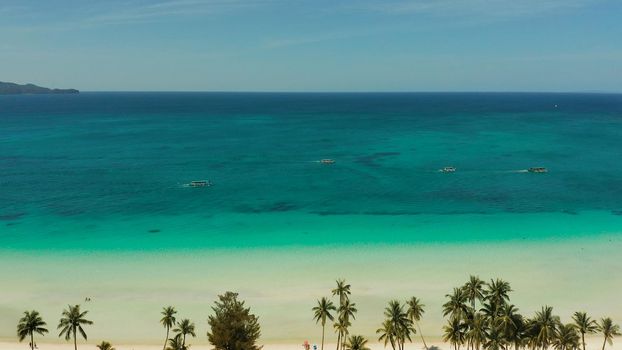 Tropical sandy beach with wave and turquoise water,copy space for text, aerial view. Ocean with waves and tropical beach. Summer and travel vacation concept