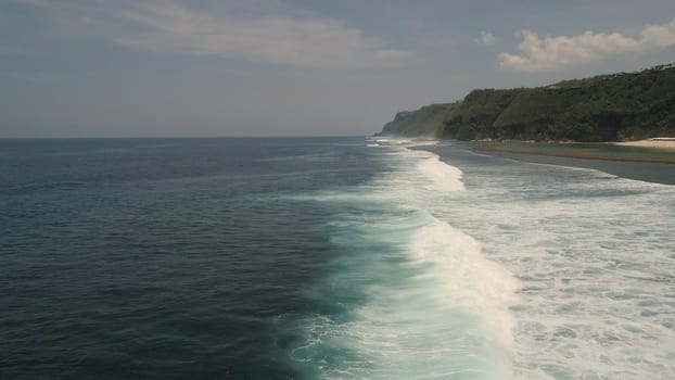 Aerial view seascape big ocean waves surf. tropical landscape waves crushing on coral reef. Bali,Indonesia. Travel concept.