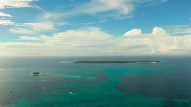 Tropical islands in turquoise lagoon and coral reef water, aerial view. Summer and travel vacation concept. Siargao,Philippines.