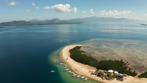 aerial view Island with sandy beach in the honda bay. Tropical island and coral reef with tourists. starfish island. Summer and travel vacation concept, Philippines, Palawan