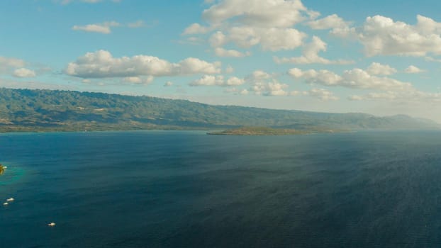 Blue sky with clouds over the sea and islands, aerial view. Seascape: Ocean and sky Cebu, Philippines.