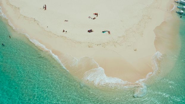 Tropical island with beautiful beach, and turquoise water view from above. Daco island, Philippines. Summer and travel vacation concept