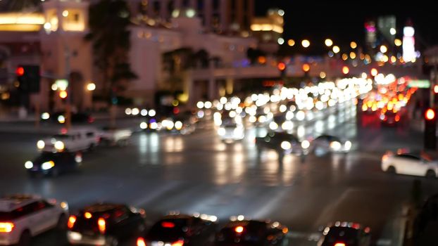 Defocused fabulous Las Vegas Strip boulevard, luxury casino and hotel, gambling area in Nevada, USA. Nightlife and traffic near Fremont street in tourist money playing resort. Neon lights of sin city.
