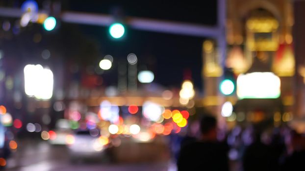 Defocused fabulous Las Vegas Strip boulevard, luxury casino and hotel, gambling area in Nevada, USA. Nightlife and traffic near Fremont street in tourist money playing resort. Neon lights of sin city.