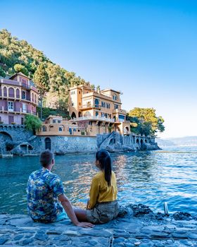 Beautiful sea coast with colorful houses in Portofino, Italy Europe Portofino in Liguria, Italy. Genoa Couple mid age man and woman visiting Italy during vacation