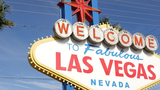 Welcome to fabulous Las Vegas retro neon sign in gambling tourist resort, USA. Iconic vintage banner as symbol of casino, games of chance, money playing and hazard betting. Lettering on signboard.