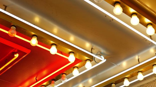 Old fasioned electric lamps blinking and glowing at night. Abstract close up of retro casino decoration shimmering in Las Vegas, USA. Illuminated vintage style bulbs glittering on Freemont street.
