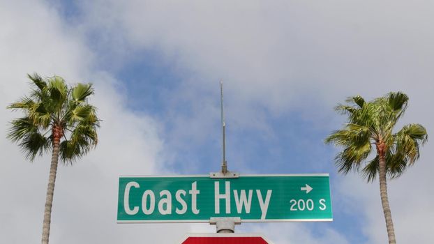 Pacific Coast Highway, historic route 101 road sign, tourist destination in California USA. Lettering on intersection signpost. Symbol of summertime travel along the ocean. All-American scenic hwy.