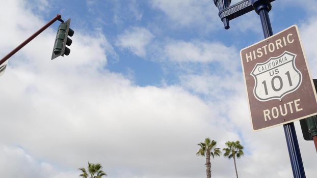 Pacific Coast Highway, historic route 101 road sign, tourist destination in California USA. Lettering on intersection signpost. Symbol of summertime travel along the ocean. All-American scenic hwy.