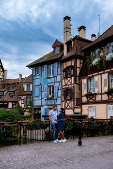 Beautiful view of colorful romantic city Colmar, France, Alsace . Europe Couple mid age men and woman on Vacation Colmar France