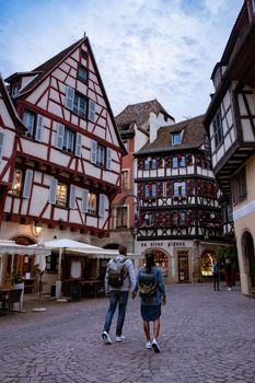 Beautiful view of colorful romantic city Colmar, France, Alsace . Europe Couple mid age men and woman on Vacation Colmar France