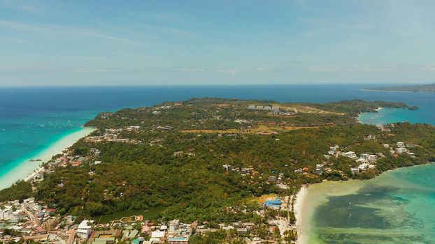 Costline of the tropical island of Boracay with sandy beaches and hotels from above. Summer and travel vacation concept. Philippines.