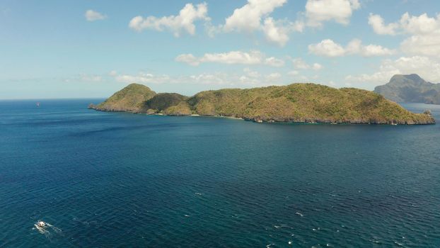 aerial view of Seascape with tropical island, blue water. islands and mountains covered with tropical forest. El nido, Philippines, Palawan. Summer and travel vacation concept