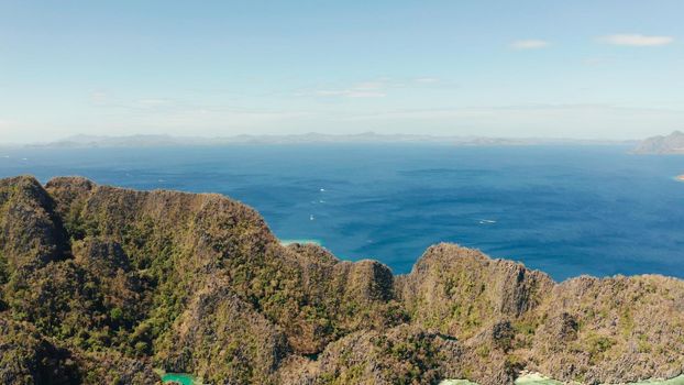 aerial view tropical islands with blue lagoons, coral reef and sandy beach. Palawan, Philippines. Islands of the Malayan archipelago with turquoise lagoons.