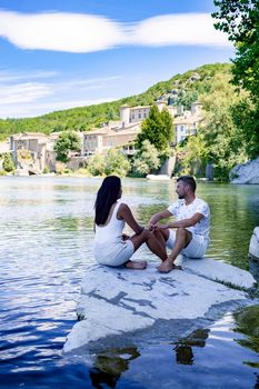 Balazuc in Southern France, Ardeche district France. couple mid age men and woman on a road trip in France visiting the village of Balazuc