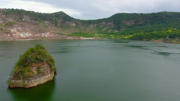 Taal volcano and the shores of the crater lake, covered with tropical greenery, top view. Tagaytay Philippines. Green lake- Taal Volcano. Travel vacation concept