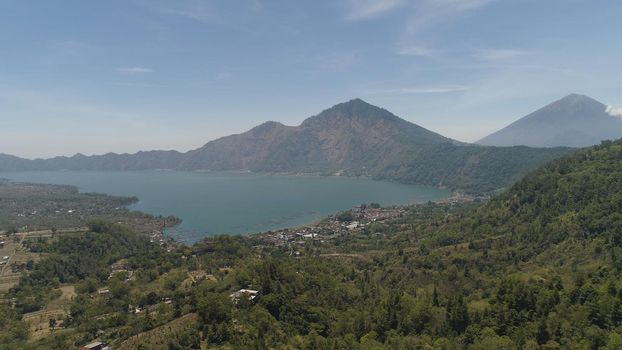 Aerial view crater lake and volcano Batur mountain landscape with volcanoes, lake with sky and clouds Bali, Indonesia. Travel concept.
