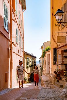 View on old part of Menton, Provence-Alpes-Cote d'Azur, France Europe during summer, couple men and woman on vacation at Menton France