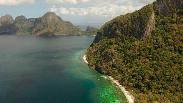 Tropical beach and clear blue water. El nido, Philippines, Palawan. Seascape with tropical rocky islands, ocean blue water. Summer and travel vacation concept