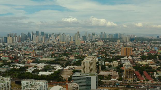 Populous city of Manila, the capital of the Philippines with skyscrapers, streets and buildings. Travel vacation concept.