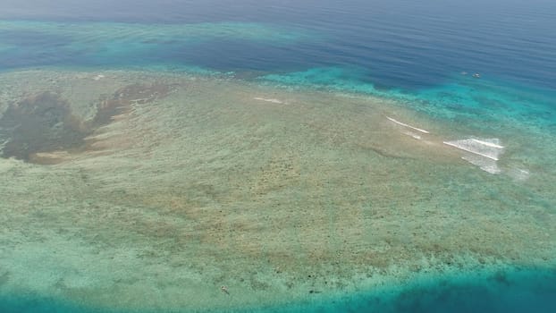 seascape aerial view coral reef, atoll with turquoise water in sea.Tropical atoll, coral reef in ocean waters. Travel concept.