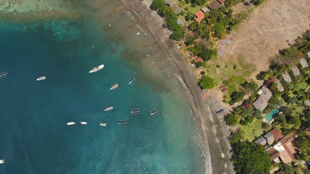 Lagoon with turquoise water and the beach in the sea bay aerial view tropical landscape, sea, boats on the surface of the water. Bali,Indonesia, travel concept.
