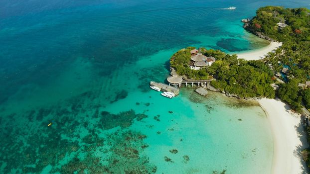 White sandy beach with tourists and hotels in Boracay Island, Philippines, aerial view. Seascape with beach on tropical island. Summer and travel vacation concept.