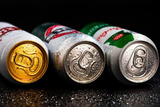 Condensation water droplets on beer cans isolated on black. Bucharest, Romania, 2020