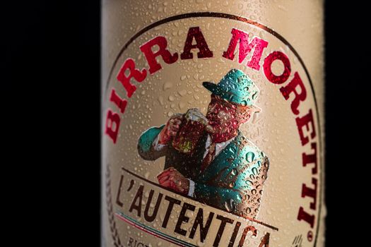Birra Moretti, a premium lager beer with water droplets on black background. Studio photo shoot in Bucharest, Romania, 2021