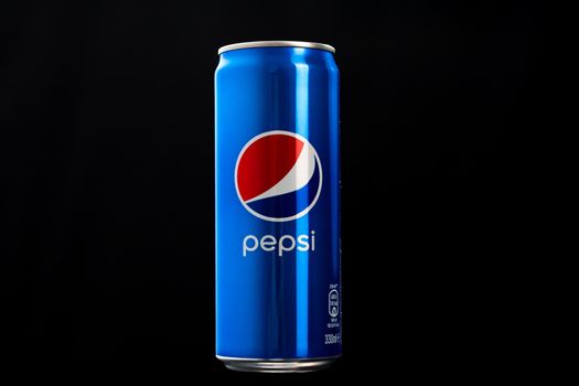 Editorial photo of classic Pepsi can on black background. Studio shot in Bucharest, Romania, 2021