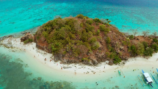 aerial view tropical island with sand white beach. Bulog Dos, Philippines, Palawan. Seascape bay with turquoise water and coral reef.