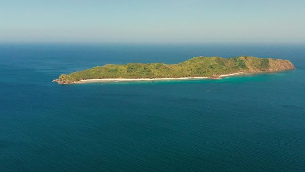 Tropical island with beach and blue water, aerial view. island and mountains covered with tropical forest. El nido, Philippines, Palawan. Summer and travel vacation concept