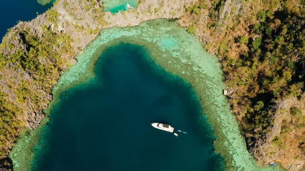 Aerial tropical landscape blue lagoon surrounded by rocks on tropical island. Seascape, tropical landscape. Palawan, Philippines, Busuanga