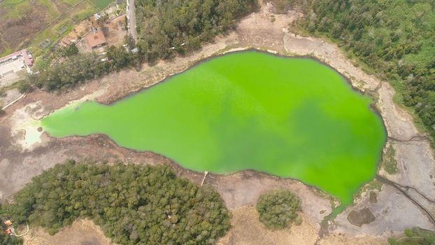 volcanic sulfur lake telaga warna in dieng plateau, java Indonesia. mountain tropical landscape lake with green water among mountains. this lake is one mainstay tourist destinations in Wonosobo Regency