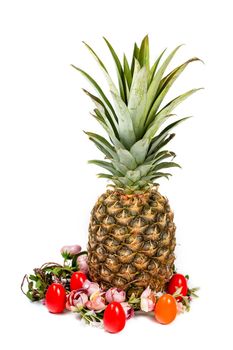 Easter composition of pineapple, flower wreath and colored eggs isolated on white background