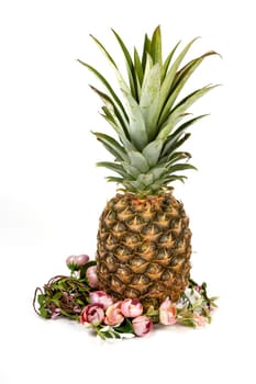 Easter composition of pineapple and flower wreath on white background.