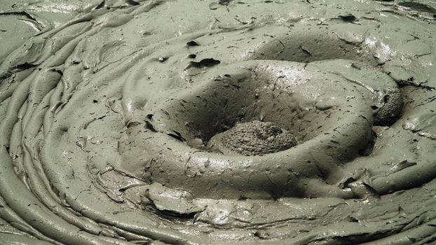 Mud volcano bledug kuwu. volcanic plateau with geothermal activity and geysers, Indonesia java. aerial view volcanic landscape