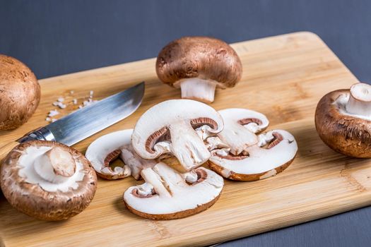 Still life of mushrooms, Royal champignons on a cutting board with knife. Delicious and healthy food concept.