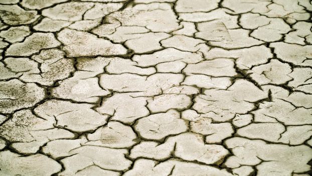 Dry cracked soil, Arid climate. Volcanic landscape around volcano. mountainous relief after volcanic eruption