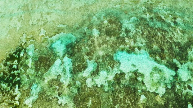 Sea water surface in lagoon with coral reef copy space for text. Top view transparent turquoise ocean water surface. background texture