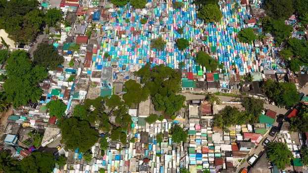 The northern cemetery in Manila with many graves and crypts in the city center aerial view. Travel concept.