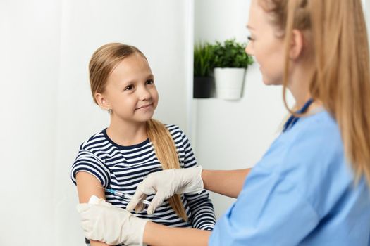 the doctor next to the child an injection health. High quality photo